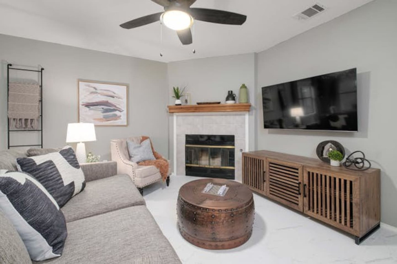 Relaxing evenings by the fireplace in this bright Austin vacation rental.