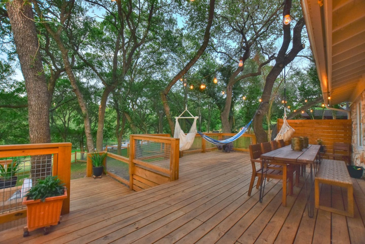 Shaded outdoor dining and hammocks under Texas oaks in Georgetown