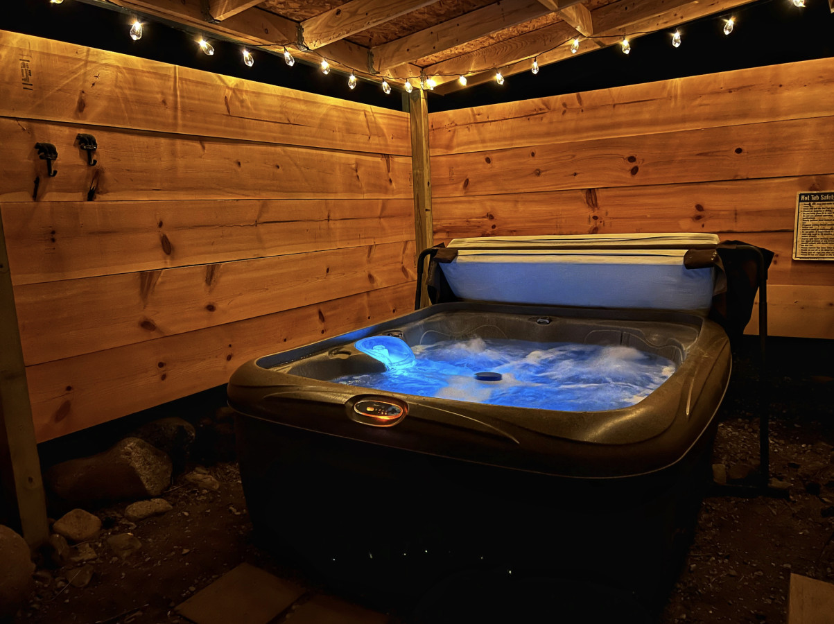 Soak under the stars in your private hot tub at this Midtown Ruidoso cabin
