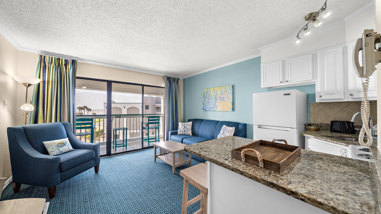 Bright family room and fully equipped kitchen—representative Casa del Mar Galveston condo layout (actual room and view may vary)