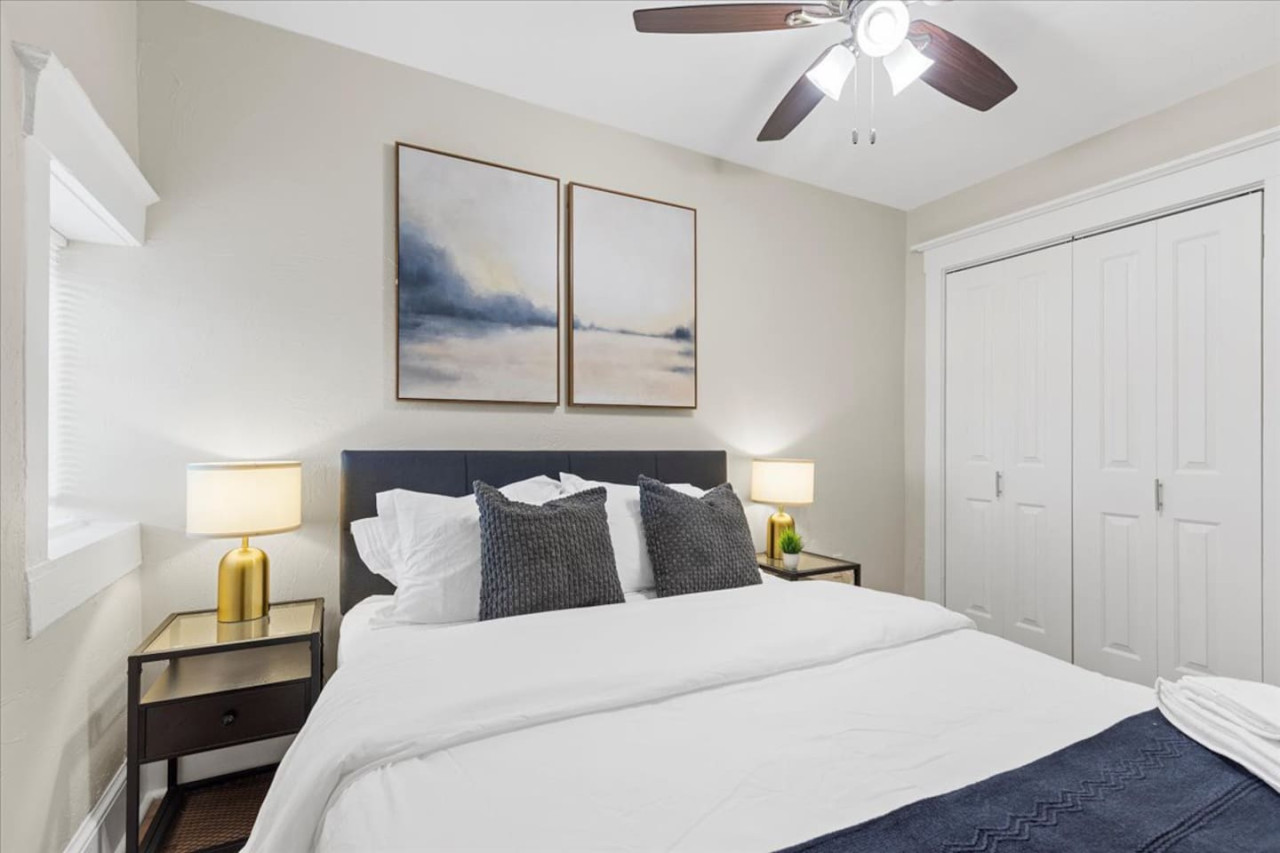 You feel enveloped in comfort as you relax on the queen bed, surrounded by a room designed for tranquility.
