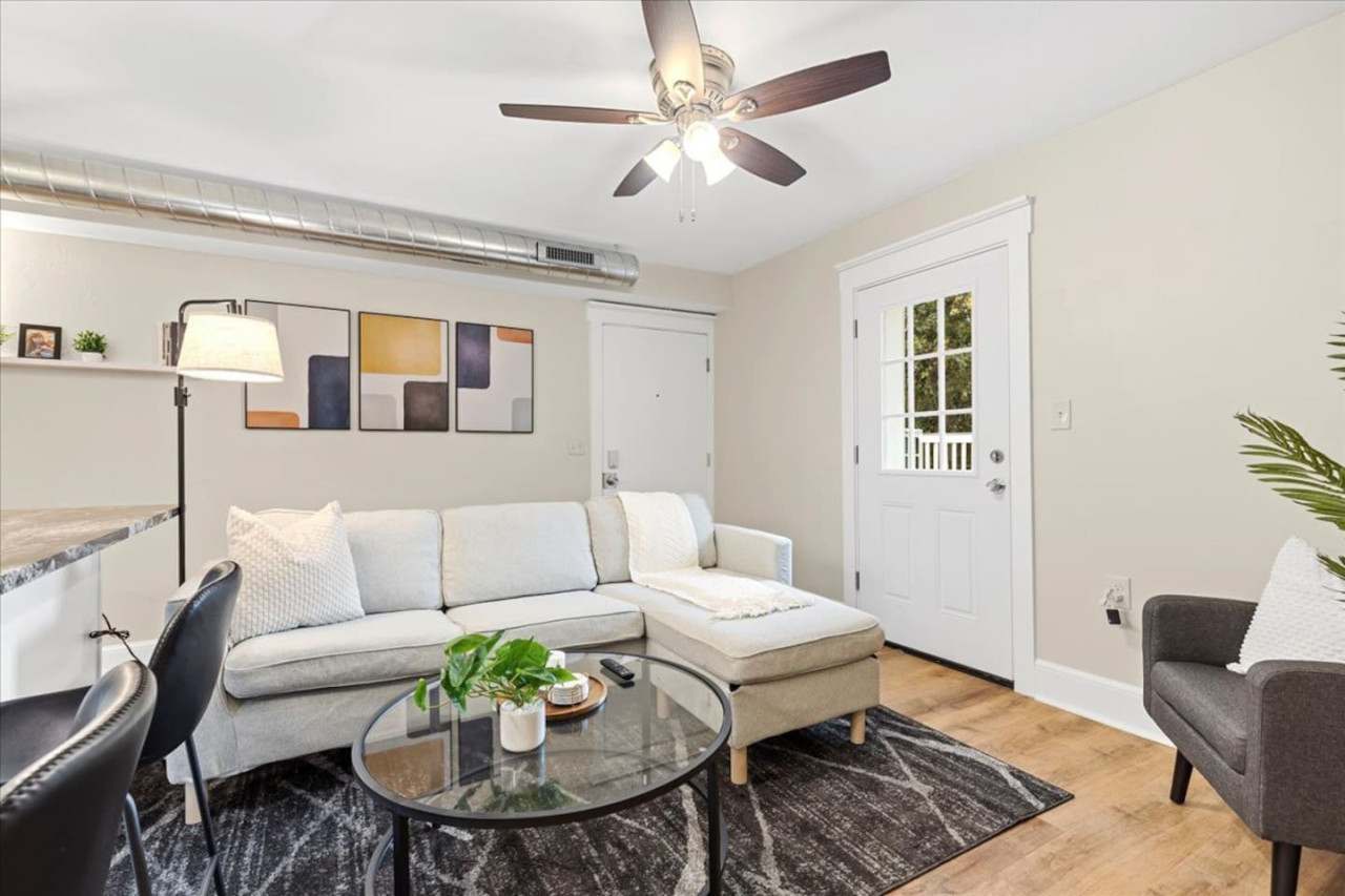 You feel at home as you settle into the living room, where the inviting atmosphere is perfect for lounging or entertaining.