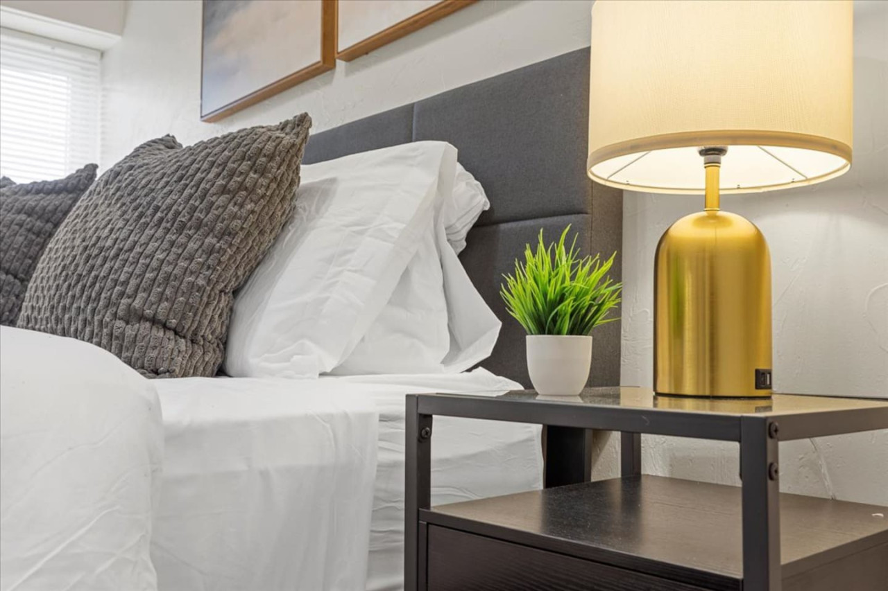 The bedroom’s serene ambiance invites you to relax, with a plush bed that promises a restful night's sleep.