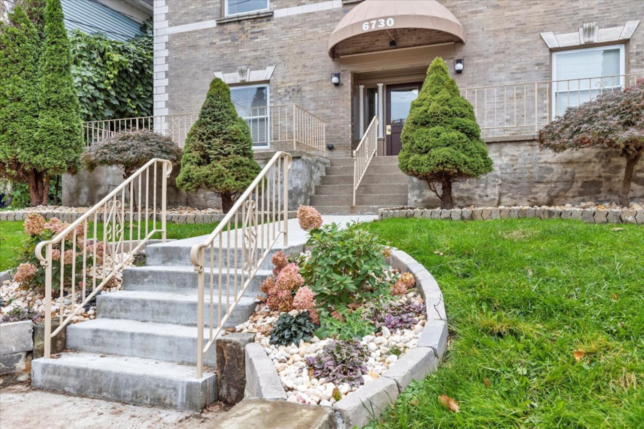 Welcoming facade of the home, showcasing beautiful architecture and a well-maintained exterior, perfect for a relaxing stay.