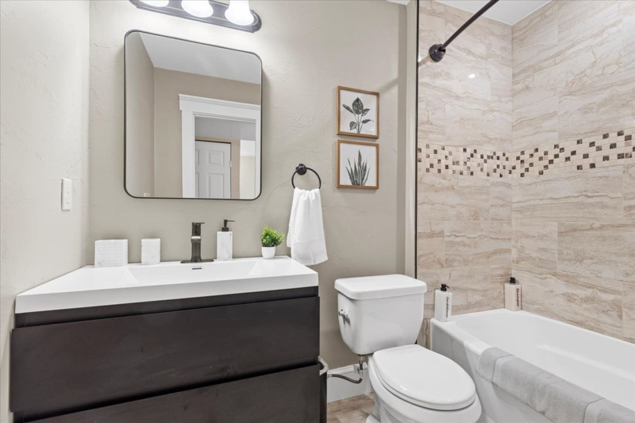 You feel a sense of calm as you enter the bathroom, where the thoughtful design and high-quality materials create a serene environment.