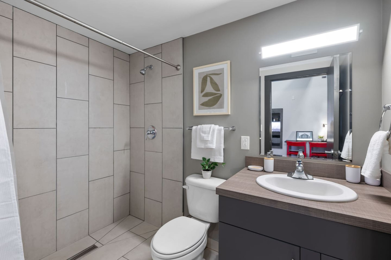 You feel a sense of calm as you enter the bathroom, where the thoughtful design and high-quality materials create a serene environment.