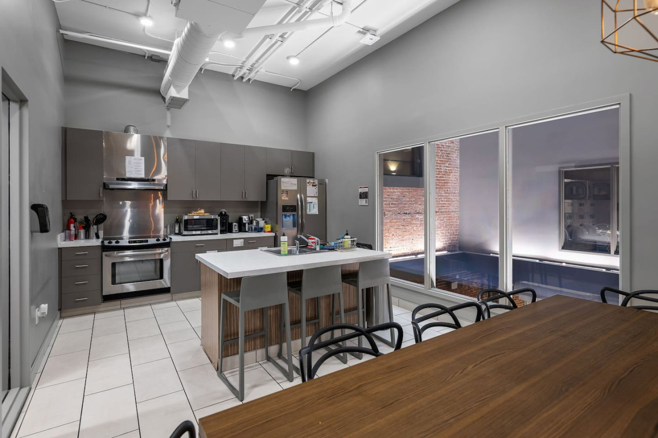 As you open the kitchen, you discover an assortment of coffee pods, and sugar, ensuring you have everything you need for a perfect morning or afternoon pick-me-up.