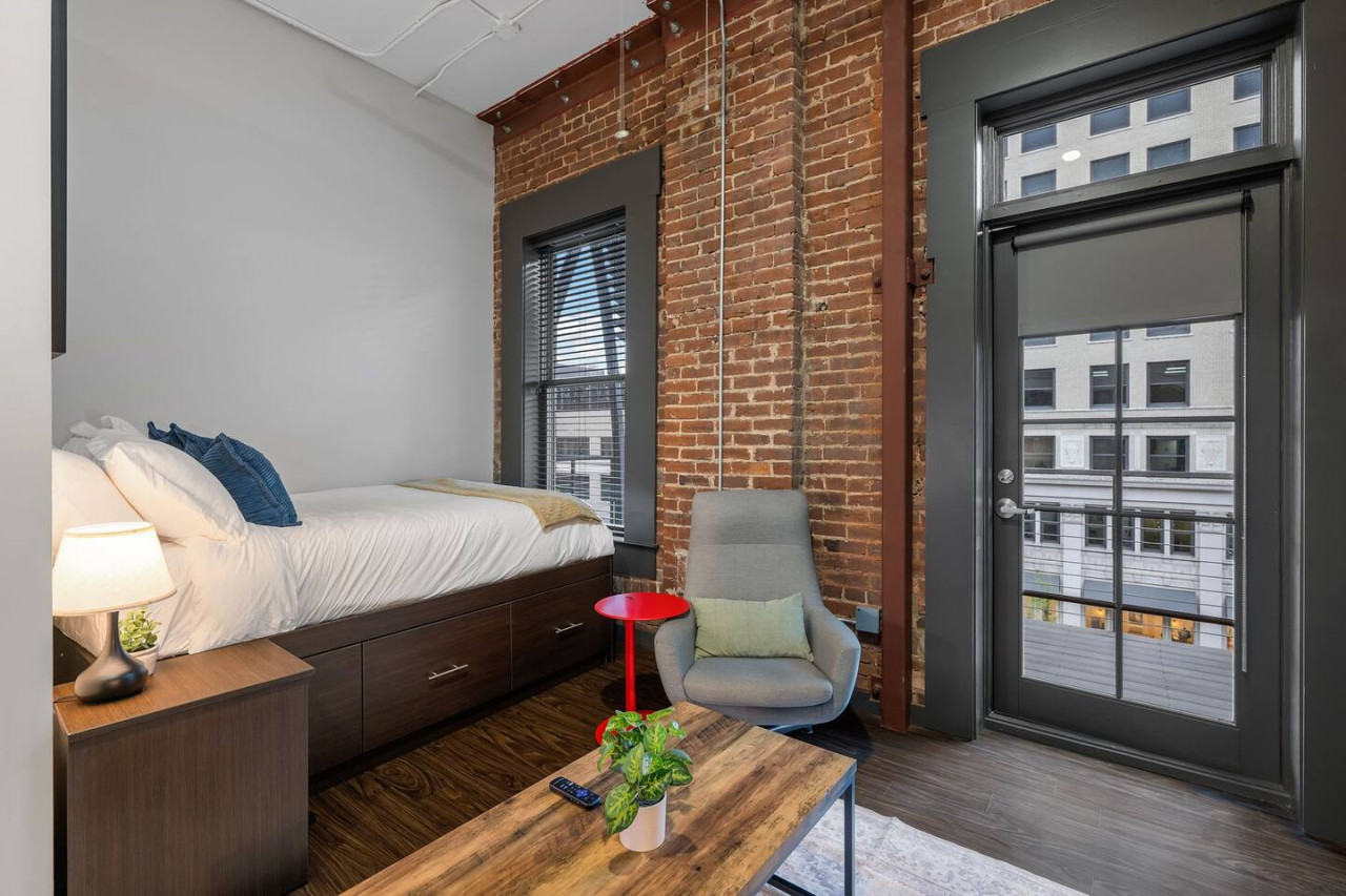 The bedroom’s serene ambiance invites you to relax, with a plush bed that promises a restful night's sleep.