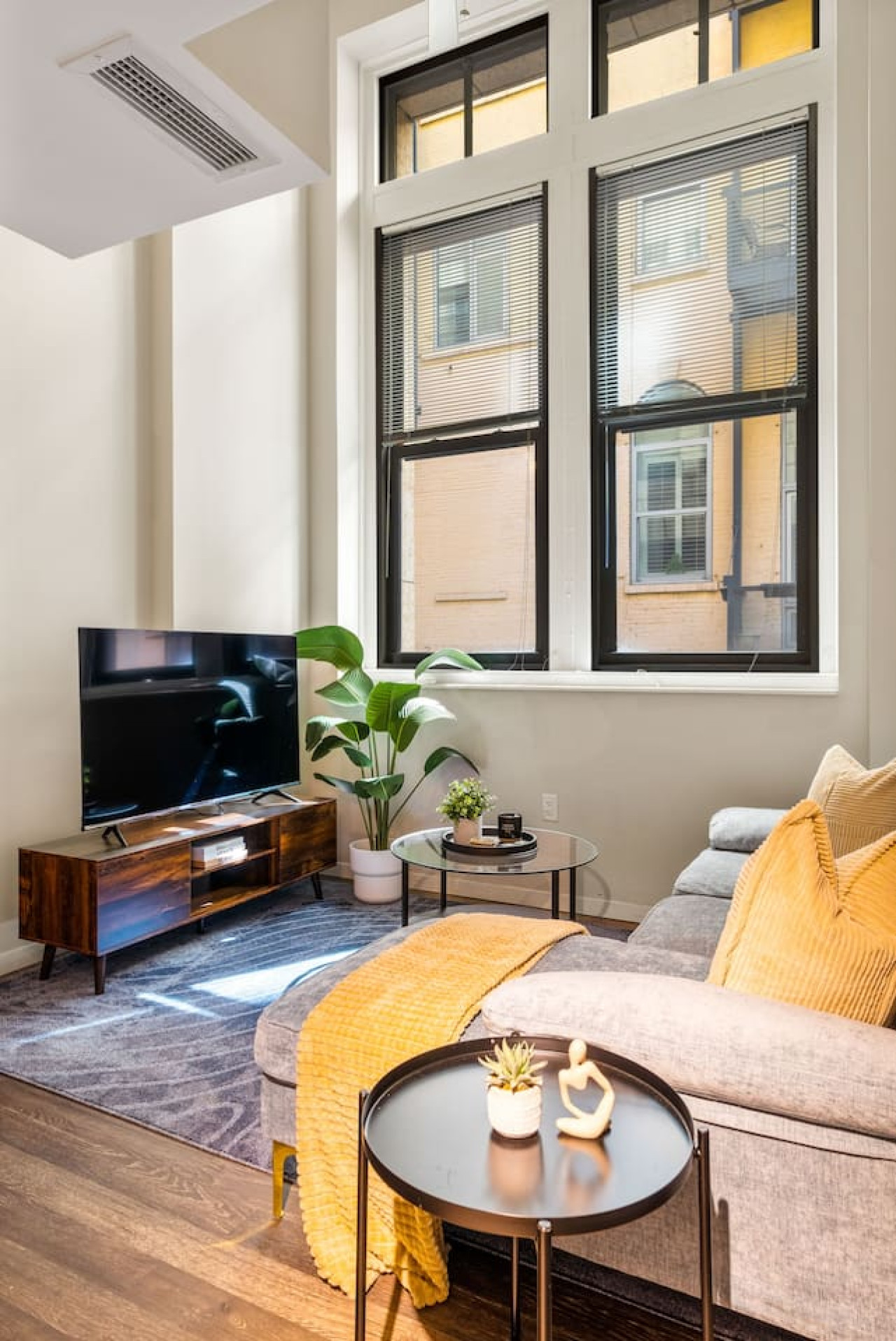 You feel a sense of peace as you step into the living room , with its inviting decor and soothing tones.