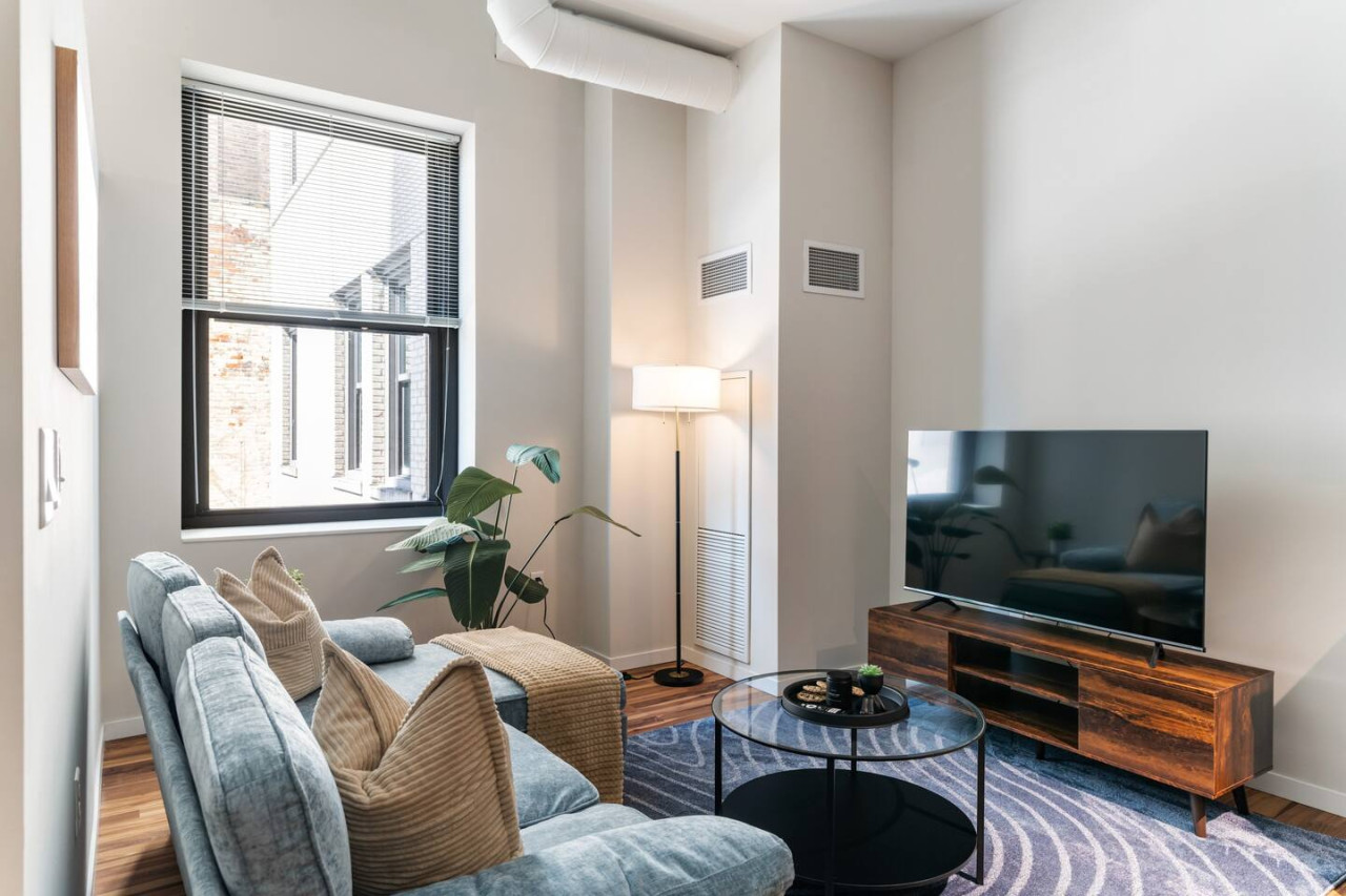 You feel a sense of peace as you step into the living room , with its inviting decor and soothing tones.