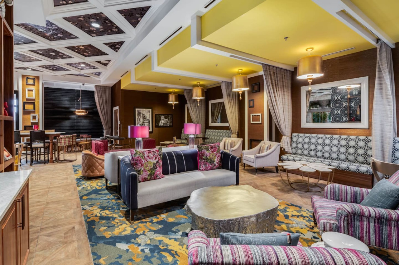 An open-concept area featuring a modern furnishings, and a stylish entertainment setup—ideal for gatherings and relaxation.
