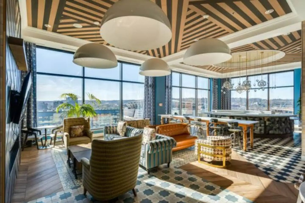 An open-concept area featuring a modern furnishings, and a stylish entertainment setup—ideal for gatherings and relaxation.