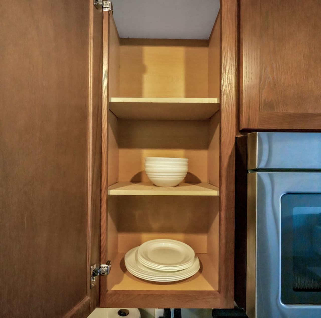 As you approach kitchen the elegant layout and well-stocked shelves make it the ideal spot to relax.