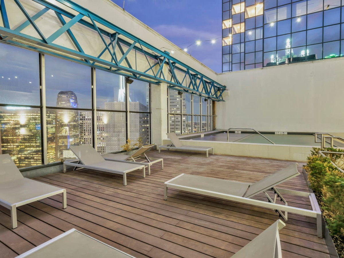 You can imagine yourself lounging by the pool, surrounded by greenery and the gentle sound of water.
