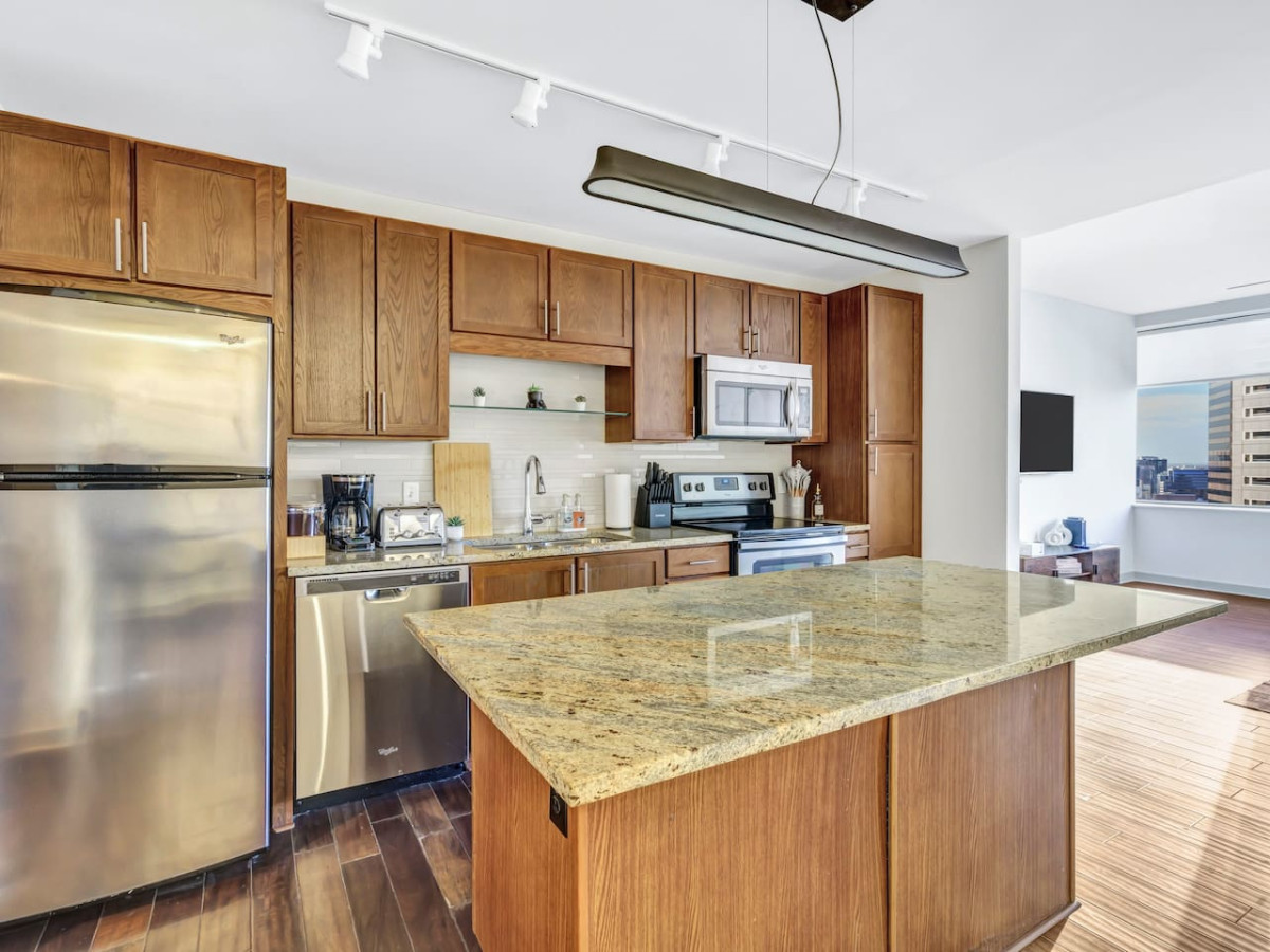 As you open the kitchen, you discover an assortment of coffee pods, and sugar, ensuring you have everything you need for a perfect morning or afternoon pick-me-up.