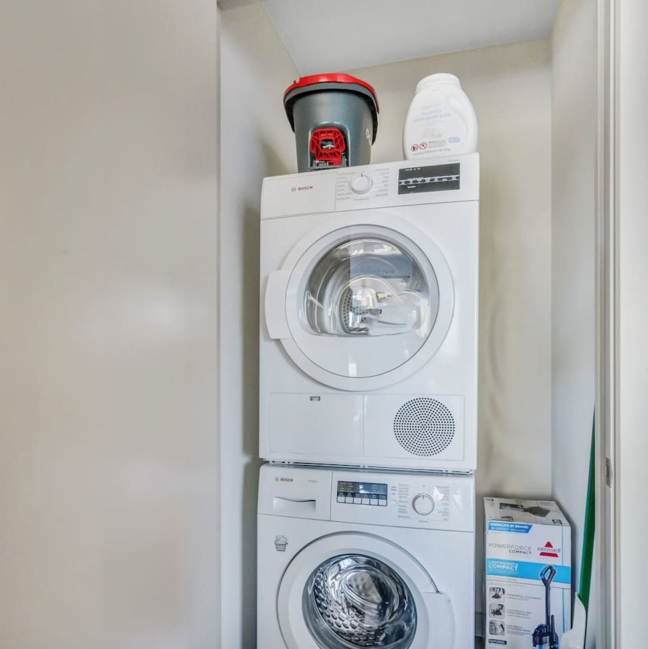 Convenient laundry room with washer, dryer, and all necessary supplies, making it easy to take care of your laundry needs.