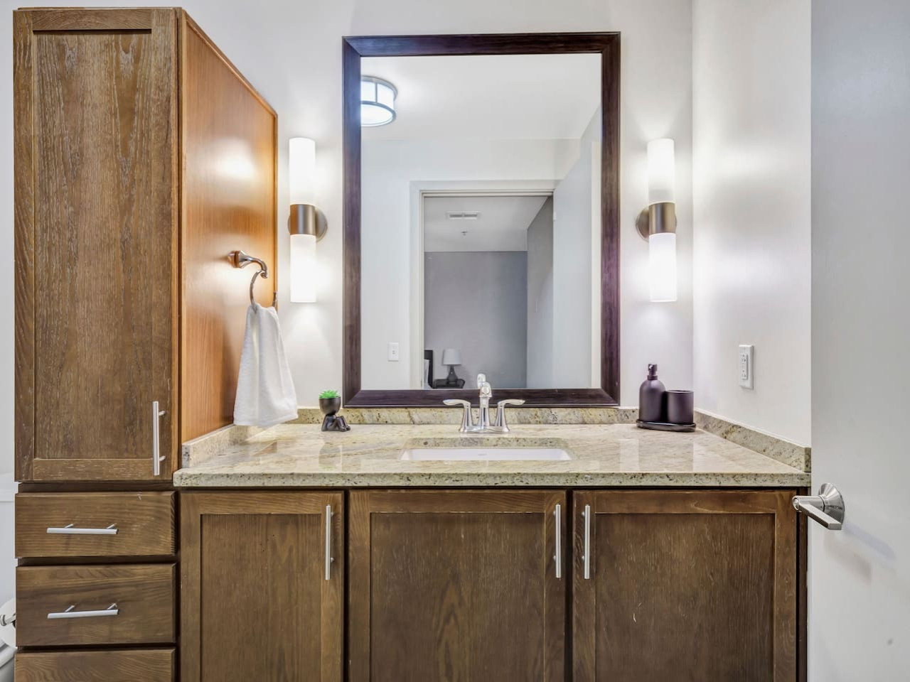 You feel a sense of calm as you enter the bathroom, where the thoughtful design and high-quality materials create a serene environment.