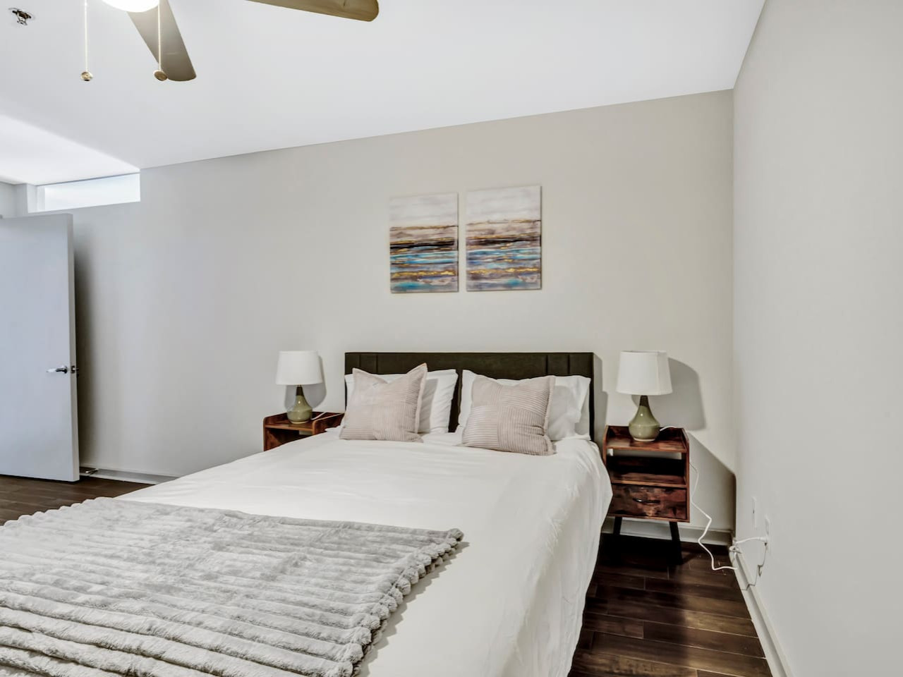 The bedroom’s serene ambiance invites you to relax, with a plush bed that promises a restful night's sleep.