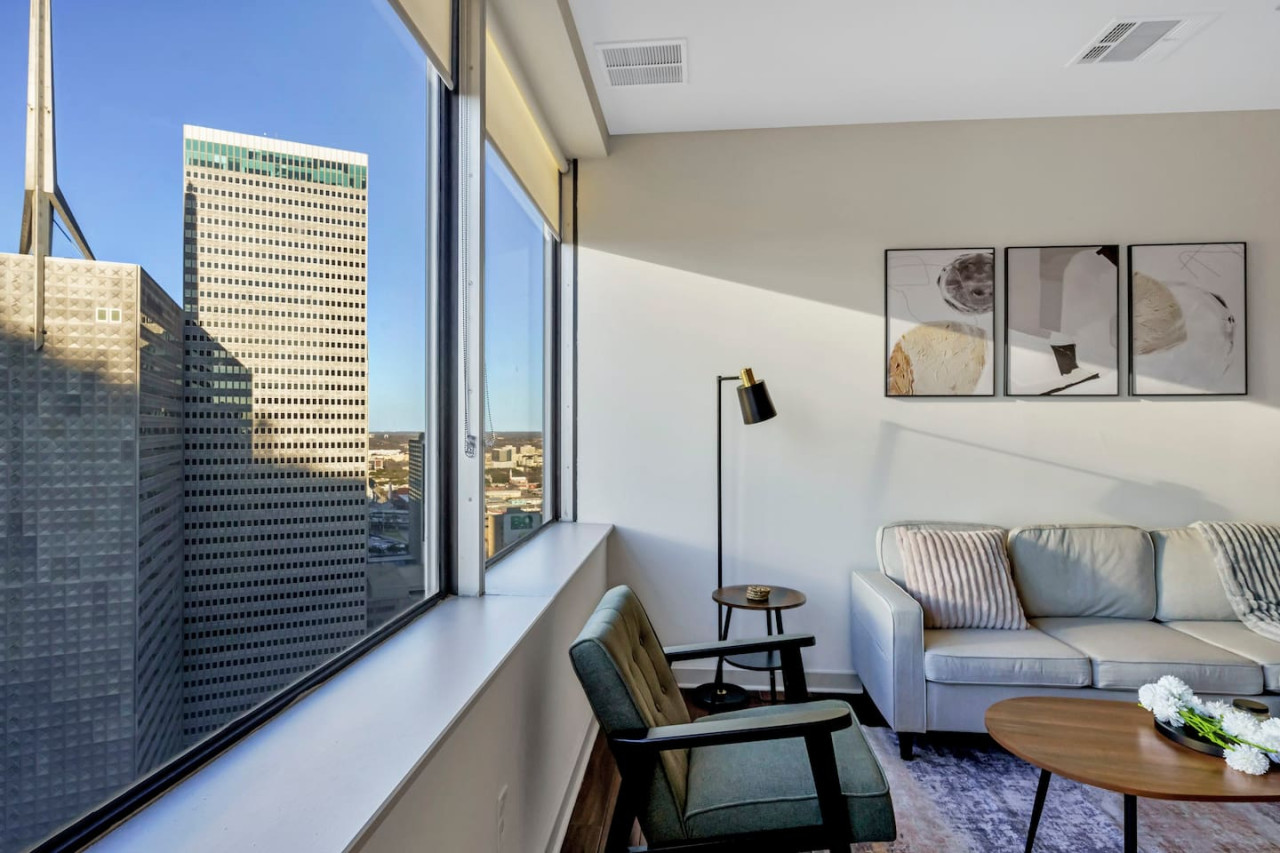 The living room is filled with natural light, creating a bright and welcoming space that invites relaxation.