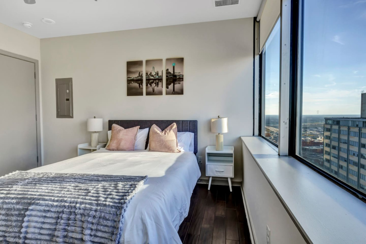 The bedroom’s serene ambiance invites you to relax, with a plush bed that promises a restful night's sleep.