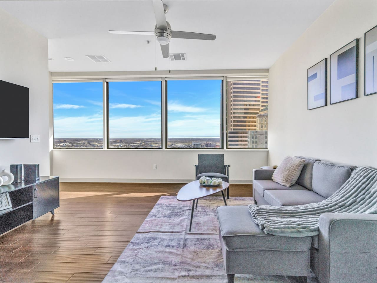 The living room is filled with natural light, creating a bright and welcoming space that invites relaxation.