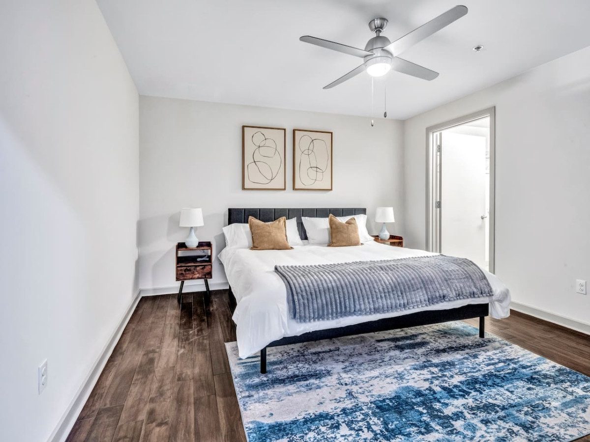 You feel enveloped in comfort as you relax on the queen bed, surrounded by a room designed for tranquility.
