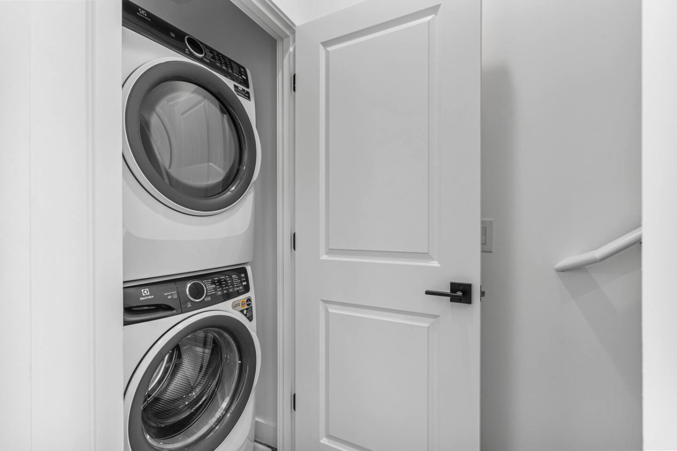 Convenient laundry room with washer, dryer, and all necessary supplies, making it easy to take care of your laundry needs.
