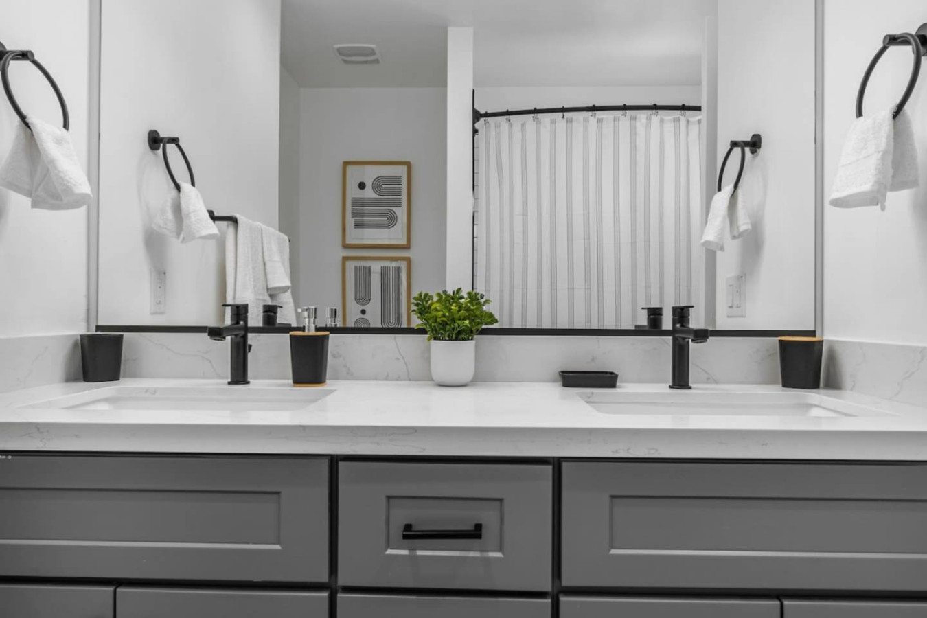 You feel a sense of calm as you enter the bathroom, where the thoughtful design and high-quality materials create a serene environment.