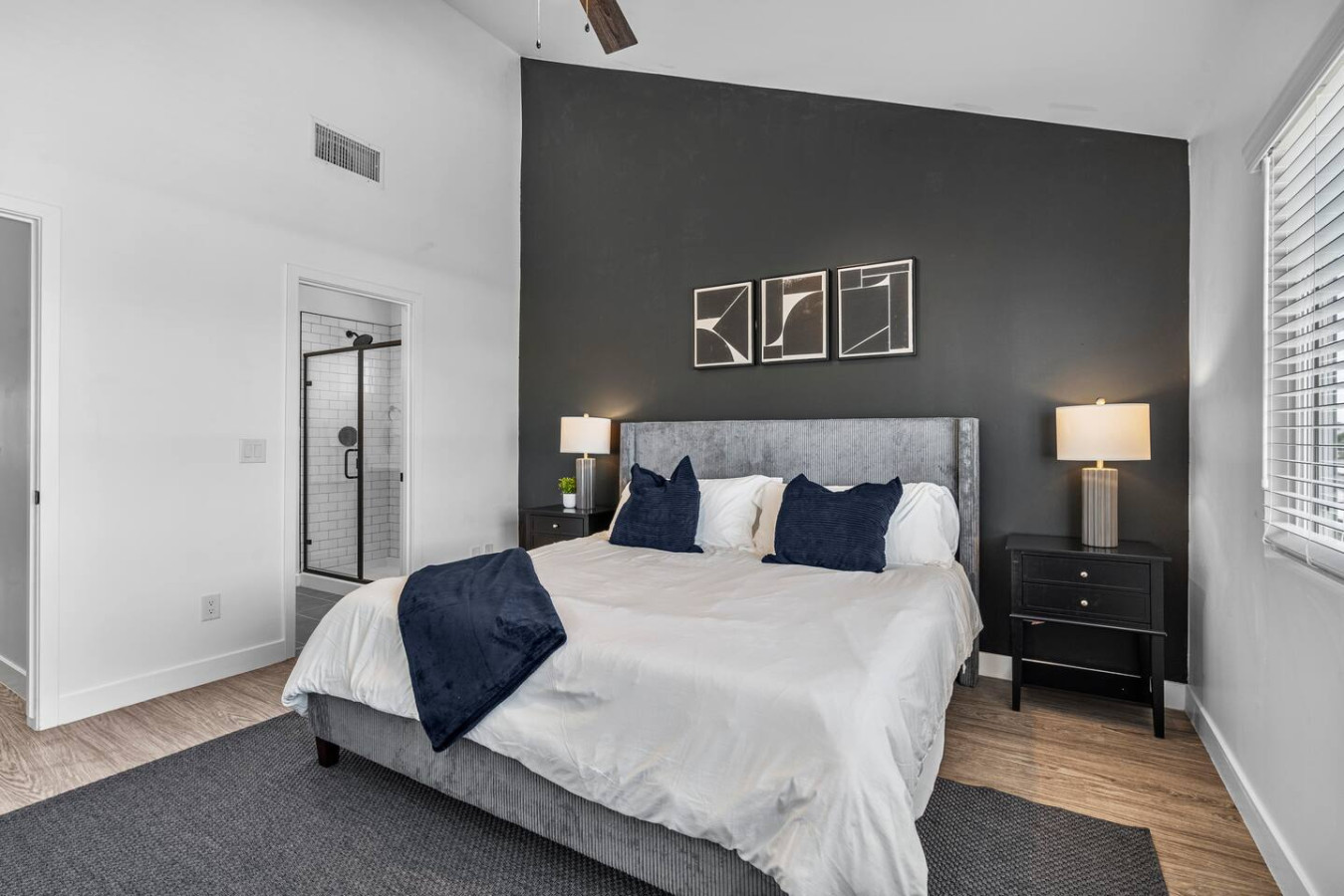 You feel a sense of serenity as you step into the king bedroom, where the elegant design and comfortable bed invite relaxation.