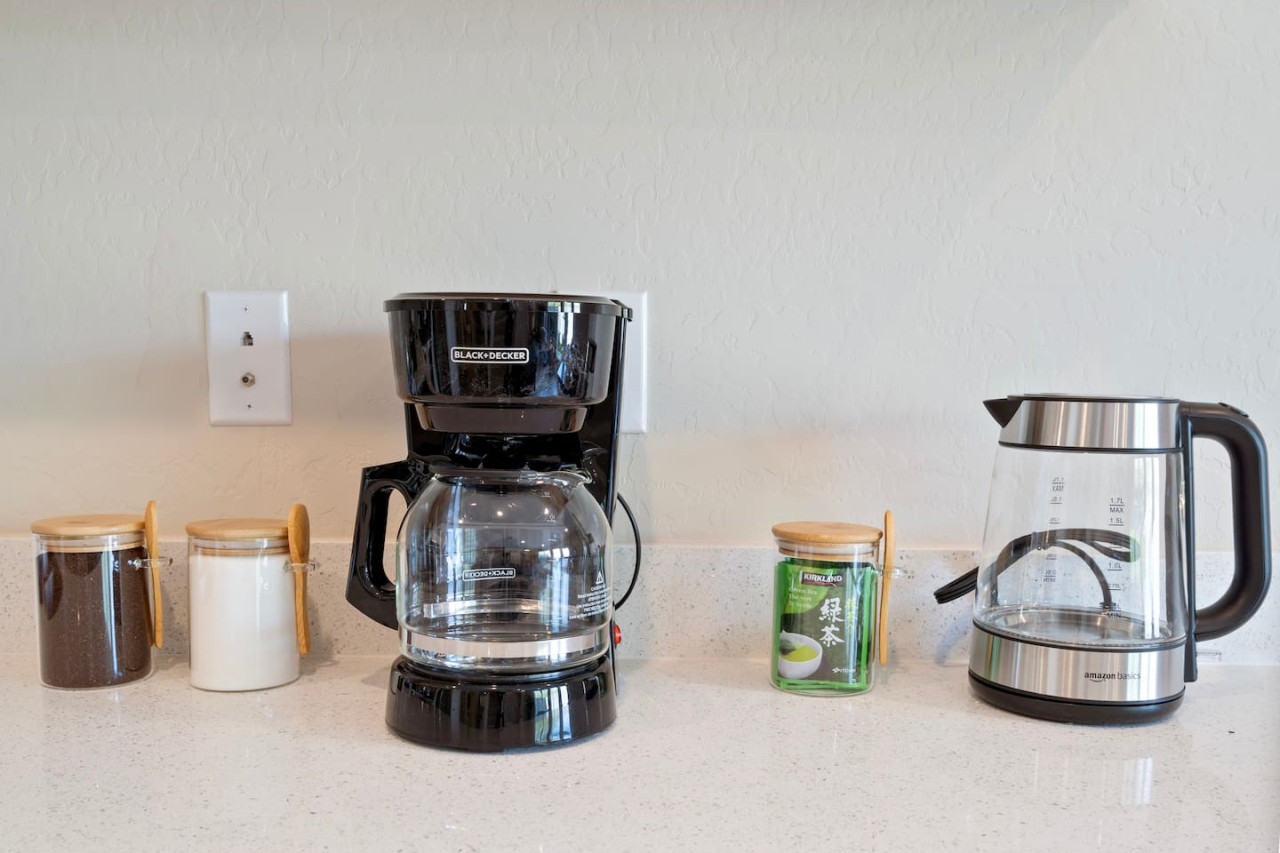 You’ll love the convenience of this fully equipped kitchen, where you can brew coffee, cook meals, or prepare snacks. The cozy layout and warm ambiance make cooking here a delightful part of your stay.