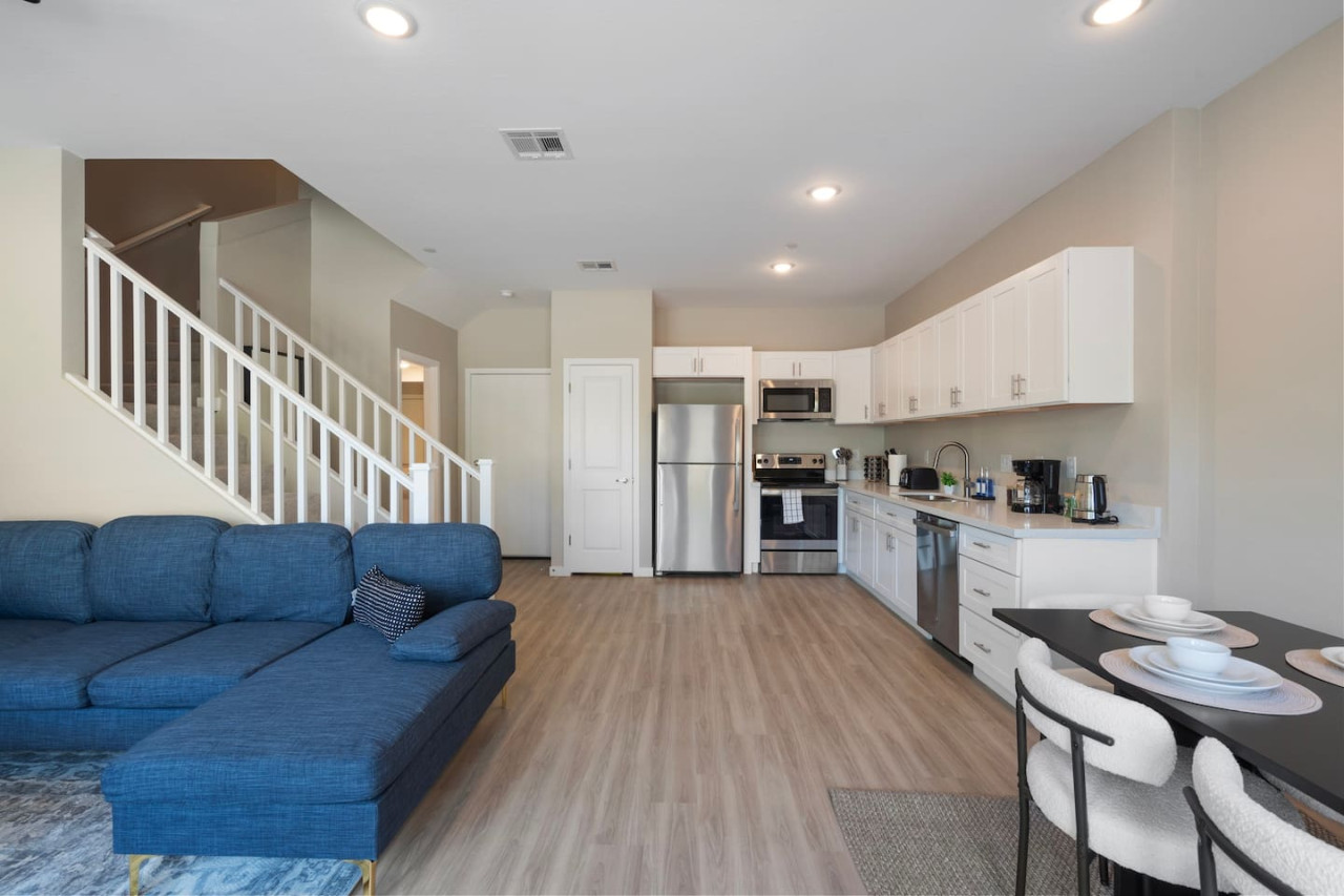 Relax in this warm, inviting space with wooden accents and cozy furnishings. You’ll love unwinding on the plush sofa, enjoying a good book or streaming your favorite shows in a serene atmosphere