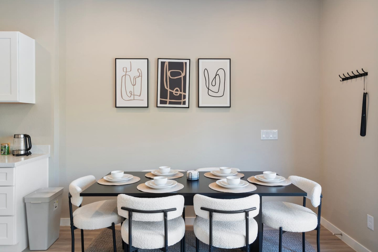 The dining room is bathed in natural light, creating a bright and inviting space where every meal feels special.