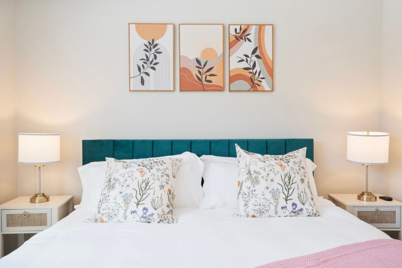 The bedroom offers a luxurious retreat, with a bed that promises restful nights and a room that feels like a private oasis.