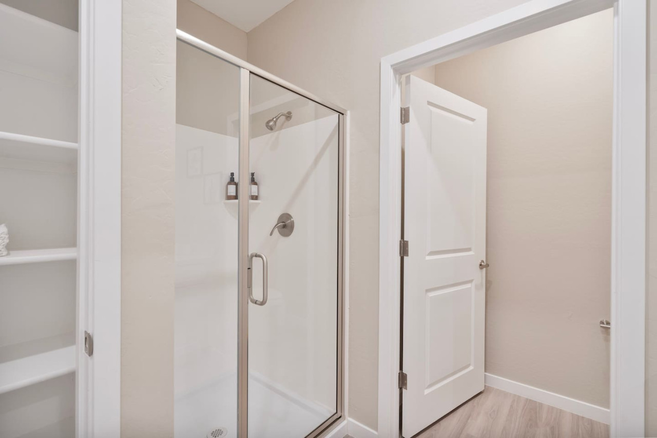 You feel a sense of calm as you enter the bathroom, where the thoughtful design and high-quality materials create a serene environment.