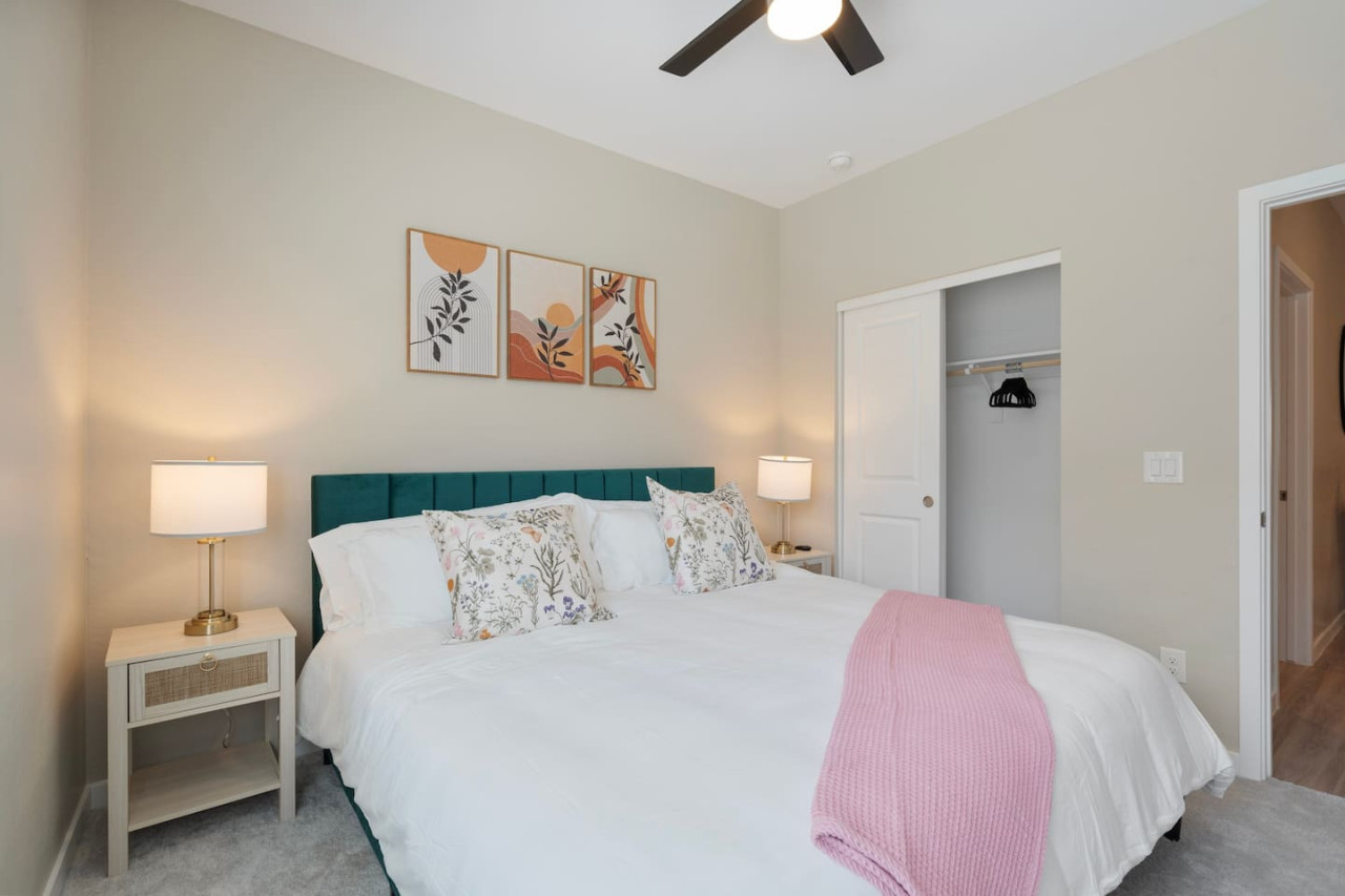 The bedroom offers a luxurious retreat, with a bed that promises restful nights and a room that feels like a private oasis.