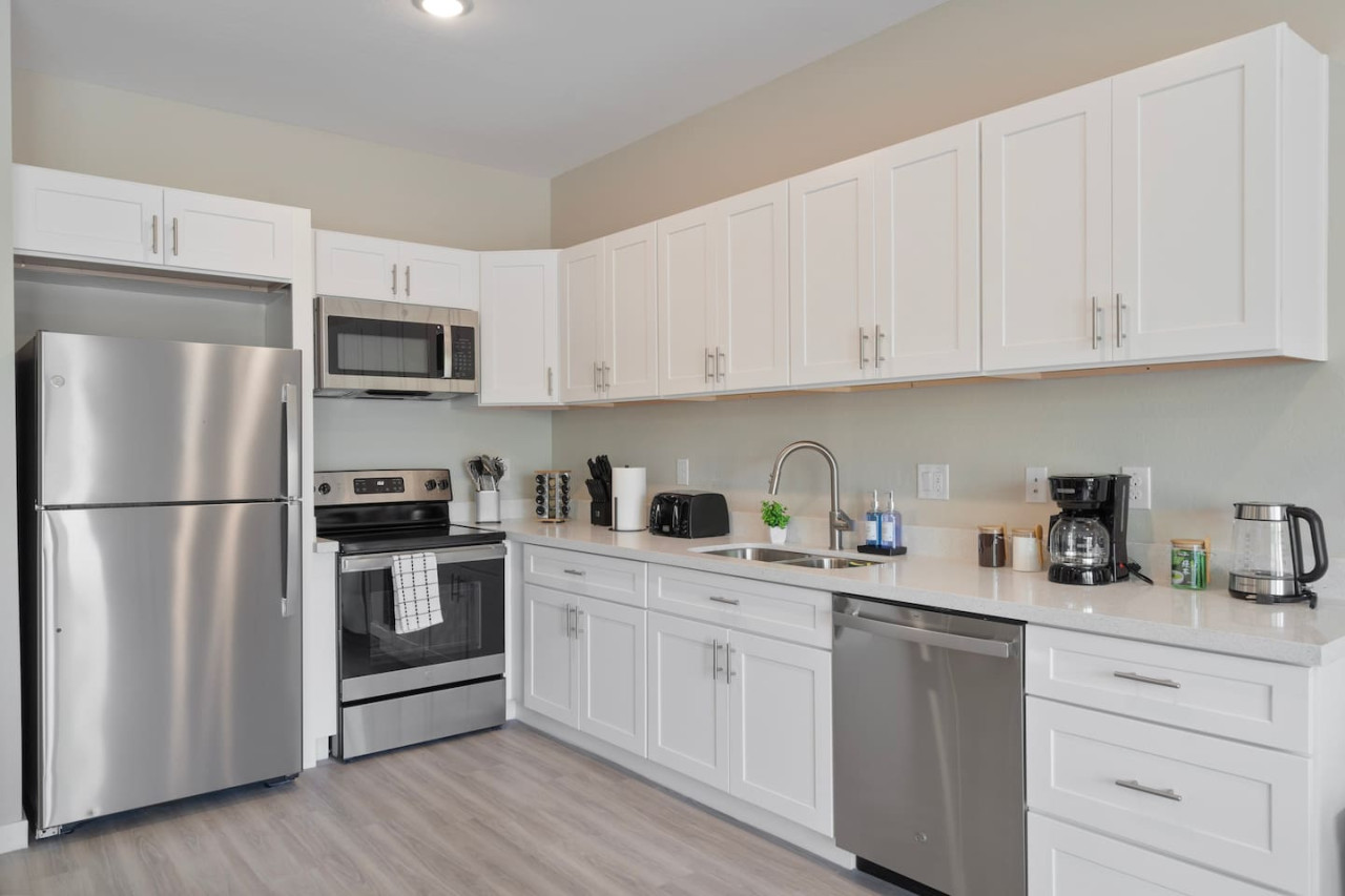 As you approach kitchen the elegant layout and well-stocked shelves make it the ideal spot to relax.