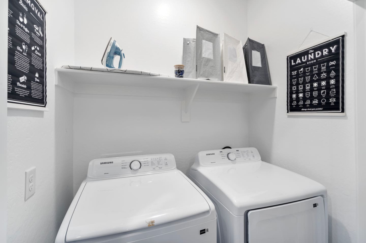 Convenient laundry room with washer, dryer, and all necessary supplies, making it easy to take care of your laundry needs.
