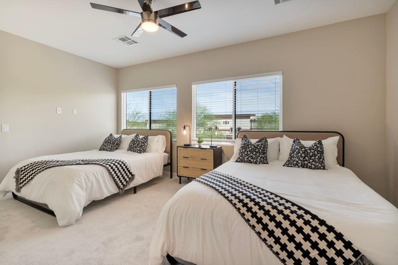 Spacious bedroom with stylish decor, perfect for unwinding after a day of exploring the local area.