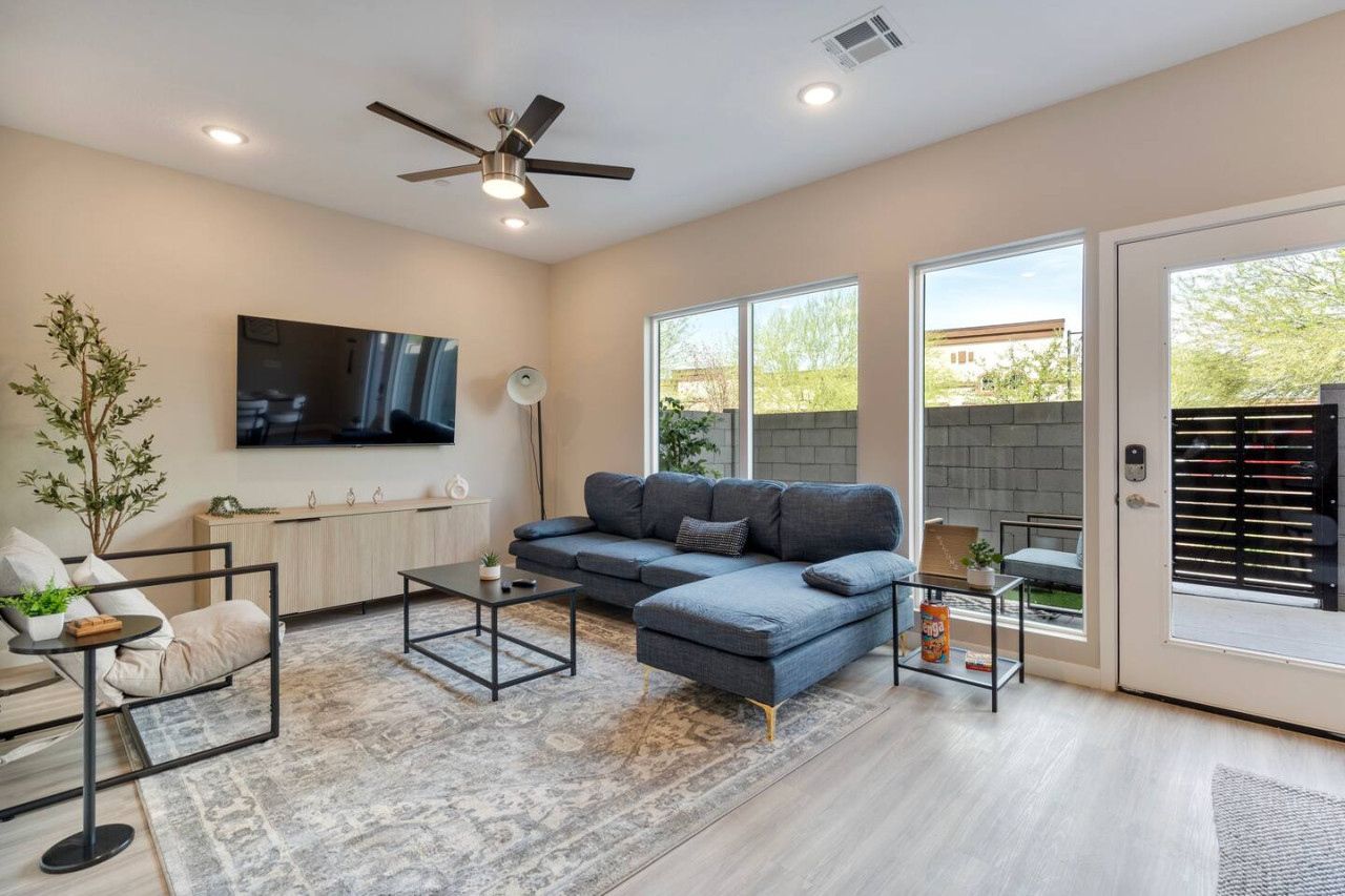Relax in this warm, inviting space with wooden accents and cozy furnishings. You’ll love unwinding on the plush sofa, enjoying a good book or streaming your favorite shows in a serene atmosphere