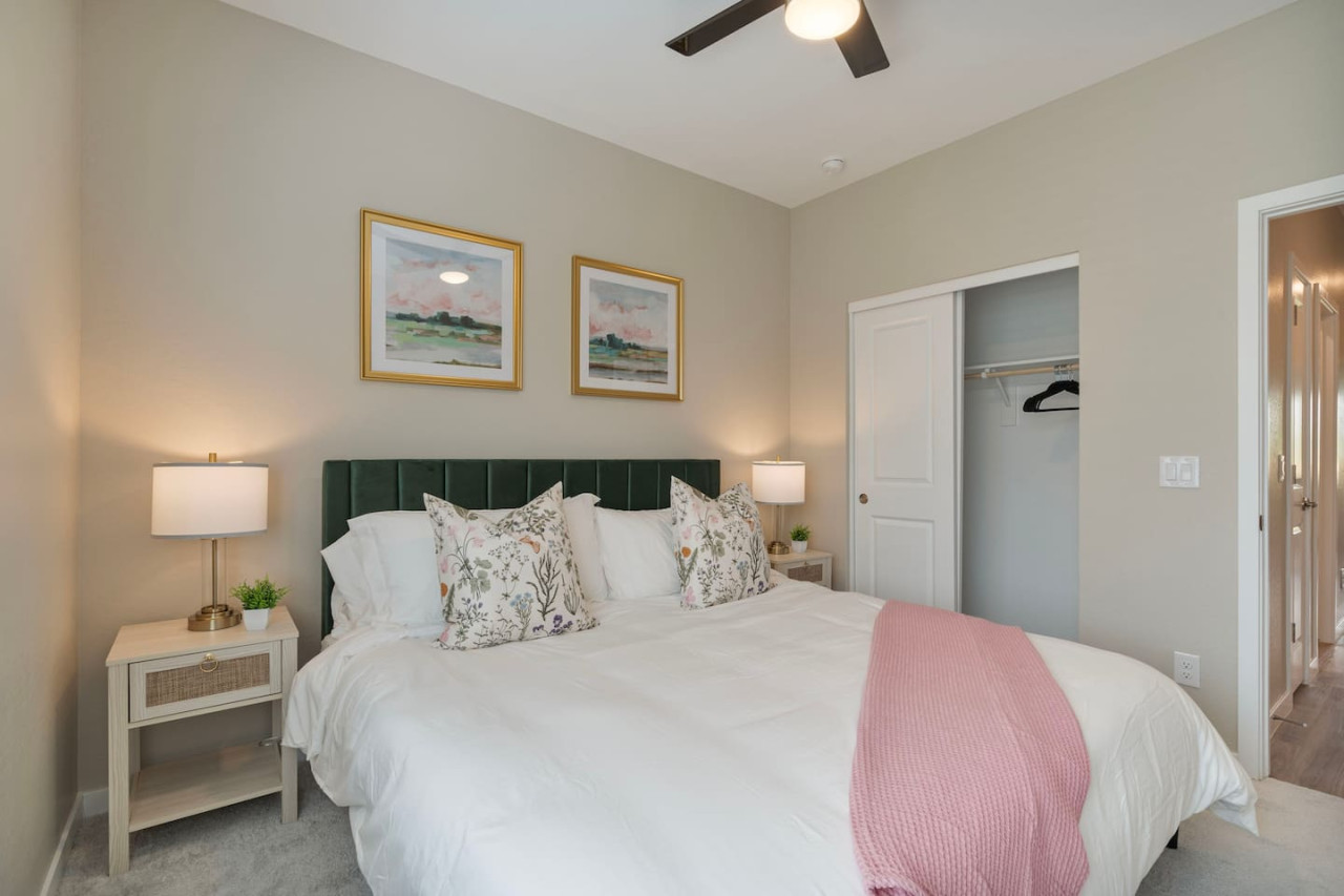 You feel a sense of serenity as you step into the king bedroom, where the elegant design and comfortable bed invite relaxation.