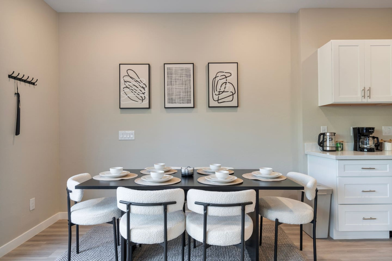 The spacious dining room invites you to savor every moment, whether enjoying a quiet meal or hosting a festive gathering.