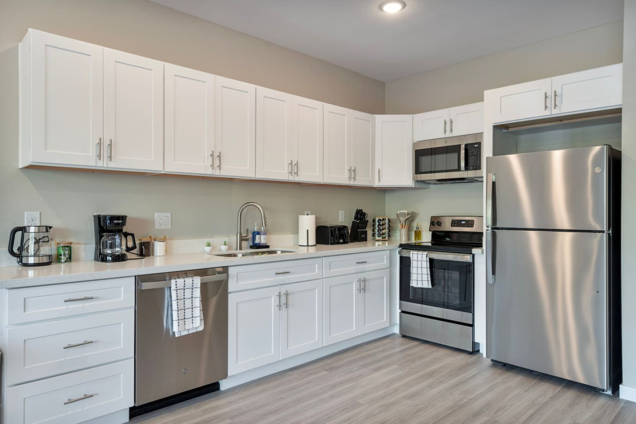 As you approach kitchen the elegant layout and well-stocked shelves make it the ideal spot to relax.