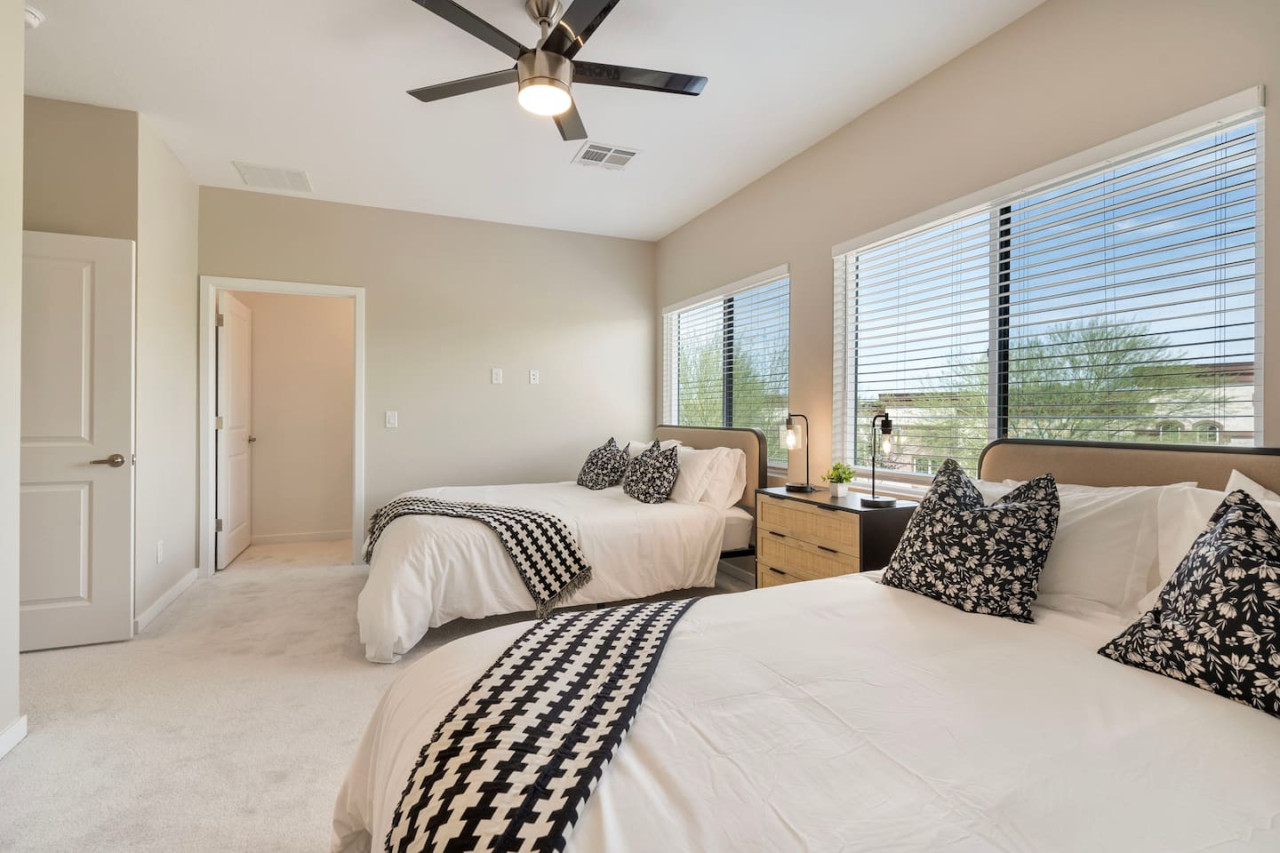 The bedroom offers a luxurious retreat, with a bed that promises restful nights and a room that feels like a private oasis.
