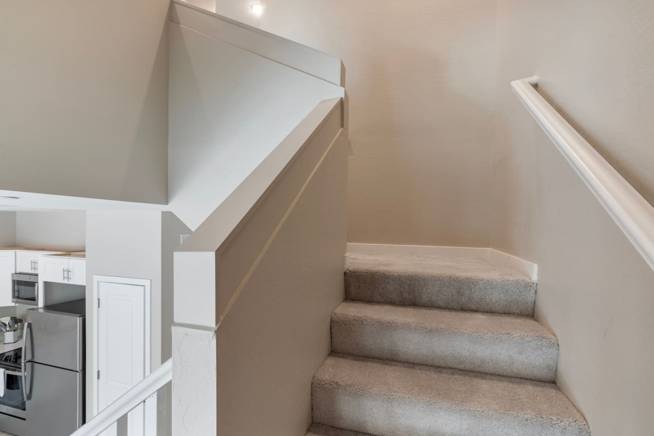 The stairs are both functional and beautiful, with a design that enhances the home’s aesthetic appeal.