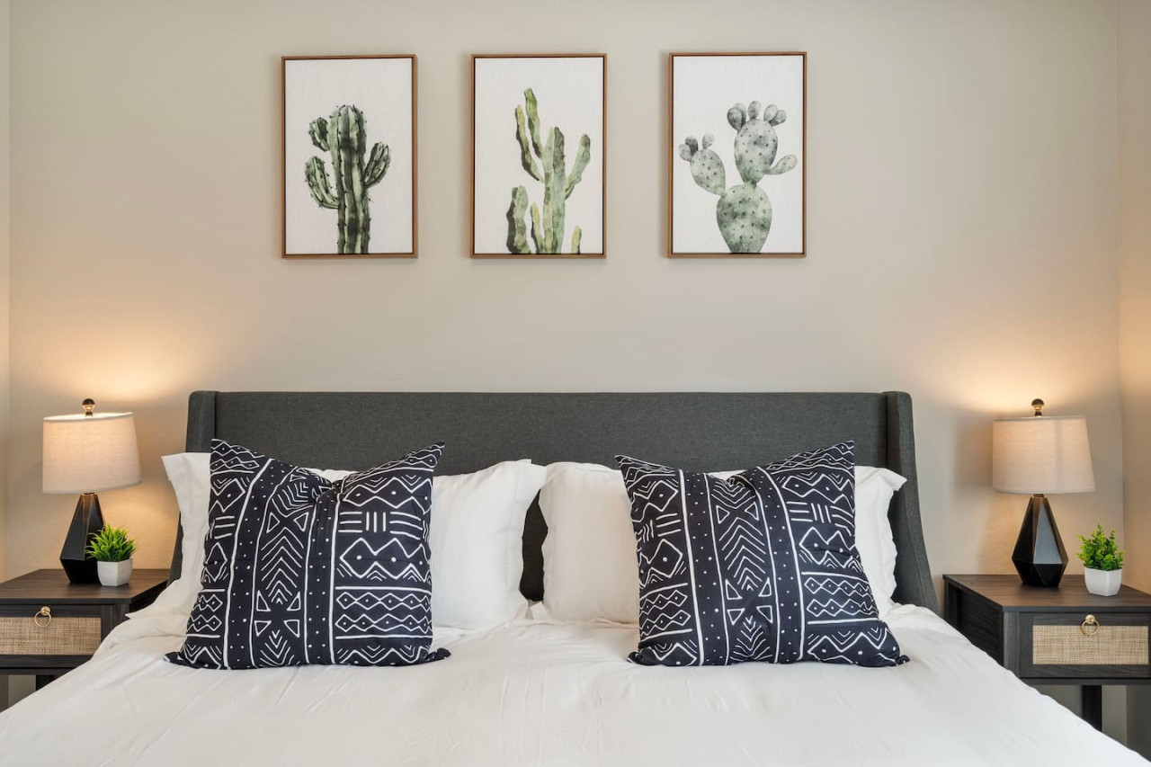 You feel a sense of serenity as you step into the king bedroom, where the elegant design and comfortable bed invite relaxation.