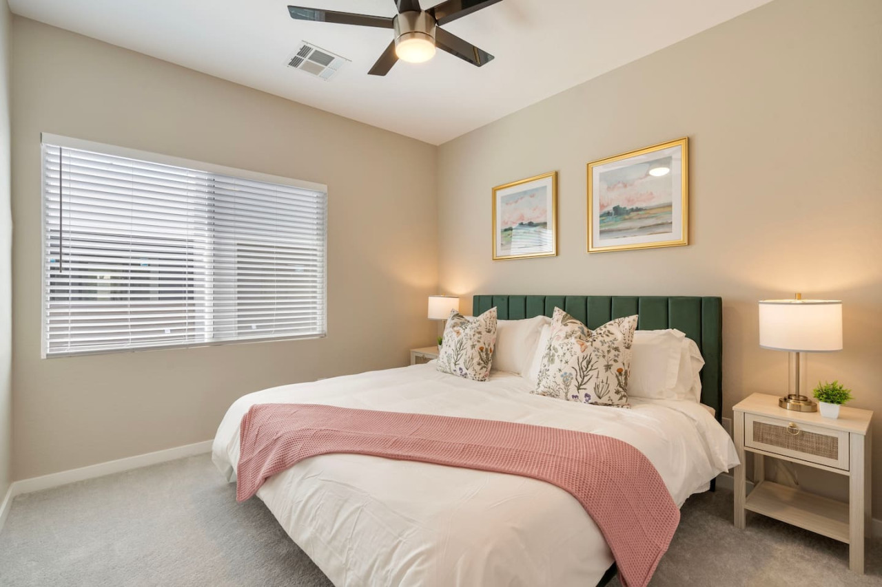 You feel a sense of serenity as you step into the king bedroom, where the elegant design and comfortable bed invite relaxation.