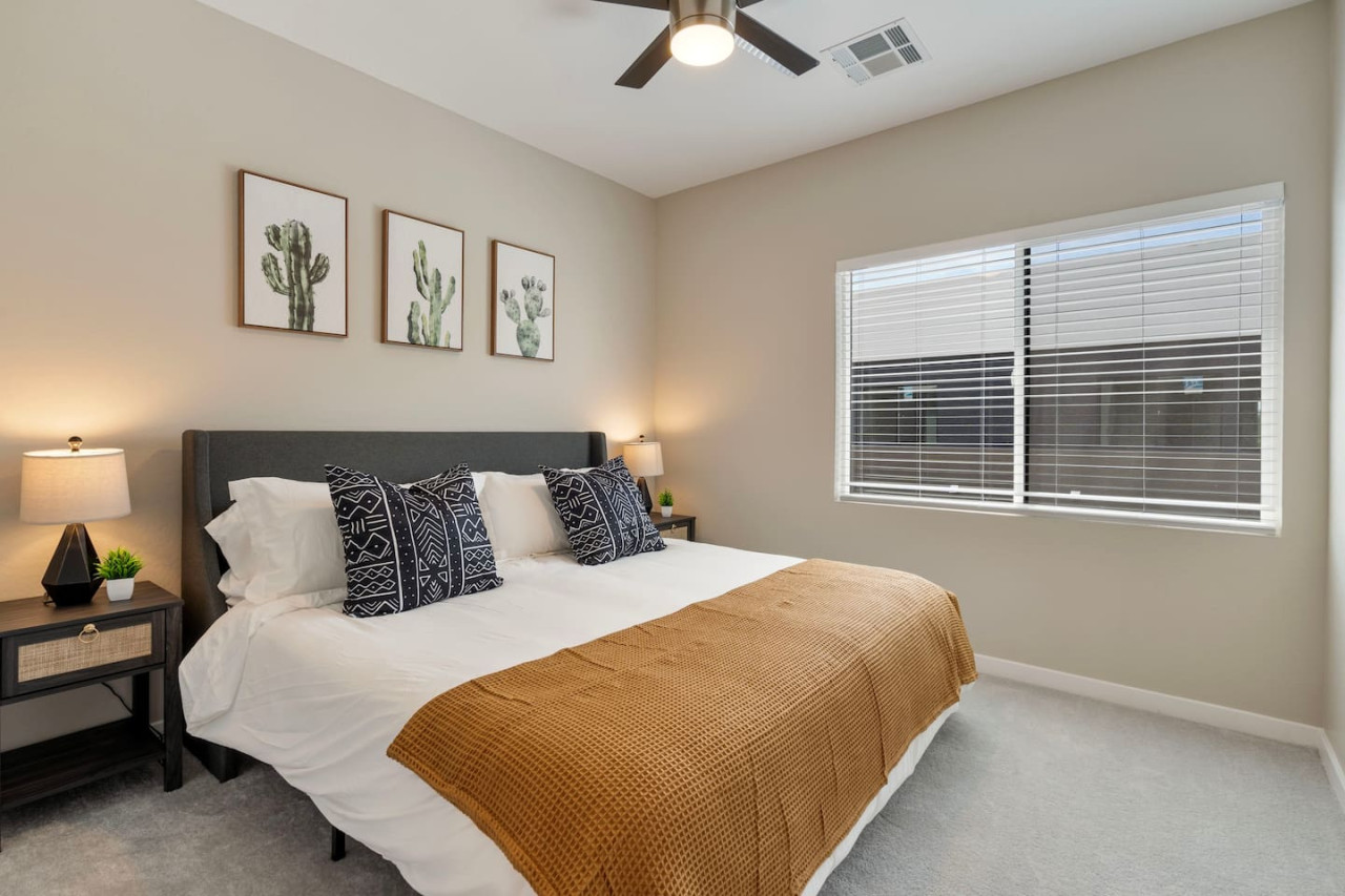 You feel a sense of serenity as you step into the king bedroom, where the elegant design and comfortable bed invite relaxation.