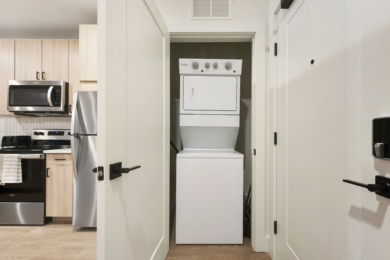 Convenient laundry room with washer, dryer, and all necessary supplies, making it easy to take care of your laundry needs.