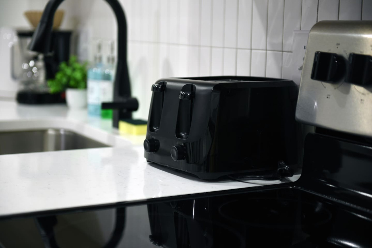 The coffee station is thoughtfully equipped with a variety of in-house consumables, including a selection of ground coffee, sweeteners, and creamers to suit every taste.
