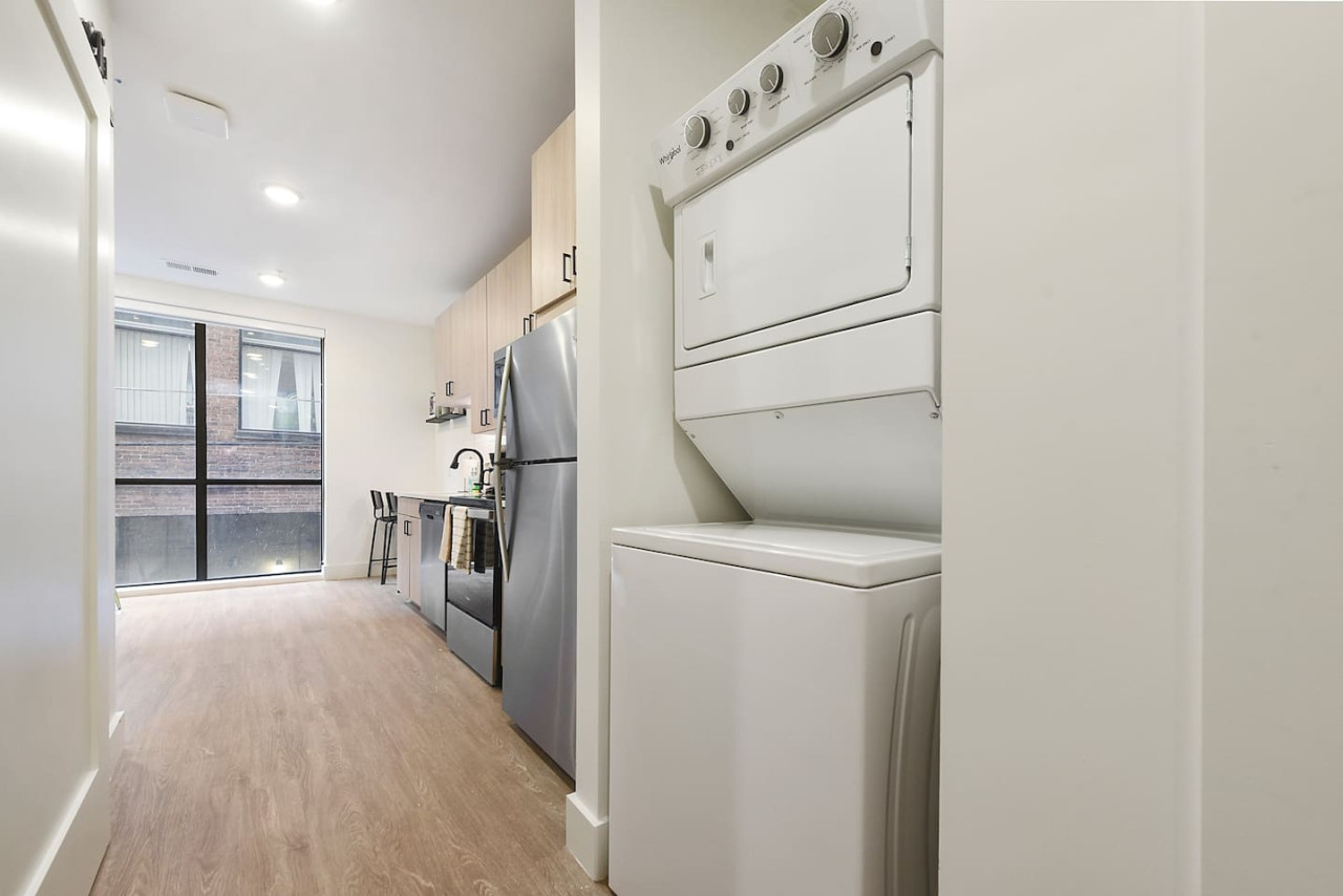 Convenient laundry room with washer, dryer, and all necessary supplies, making it easy to take care of your laundry needs.